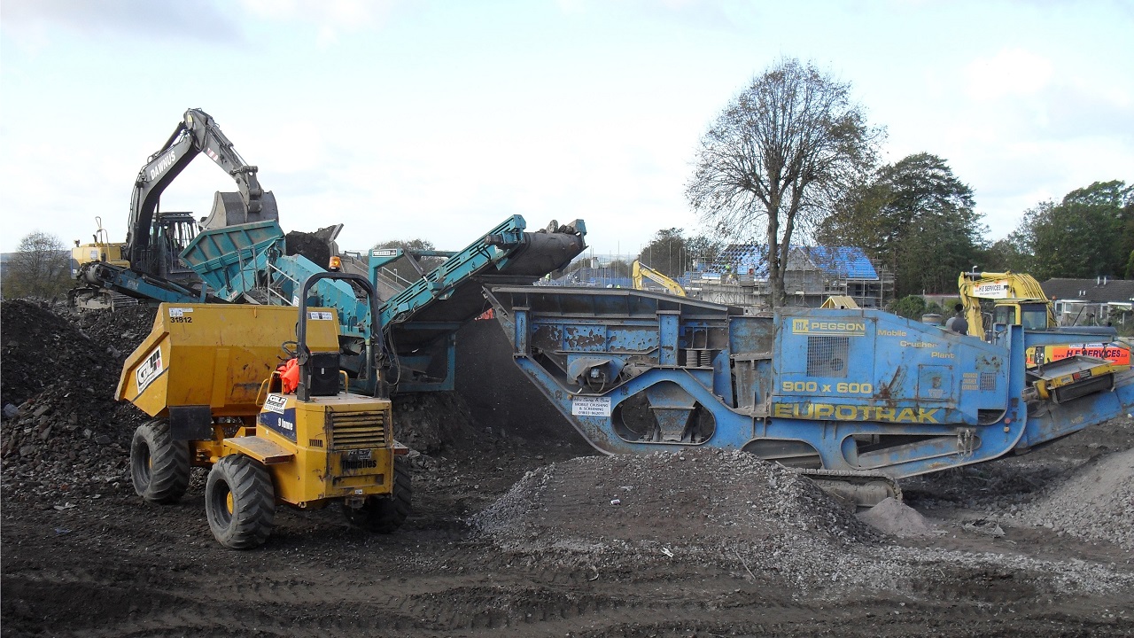 dumper excavator screener and crushers together remediating a site and producing recycled materials for reuse